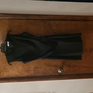 Black shift dress with a matte black metal belt.